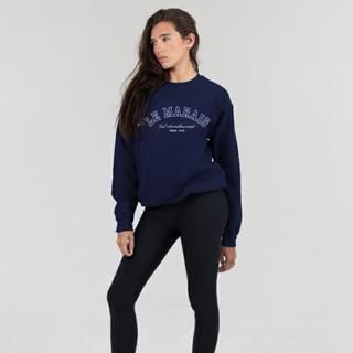 Woman wearing a navy blue sweatshirt with text on a white background