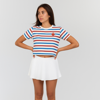 Person wearing a striped shirt and white skirt on a plain background