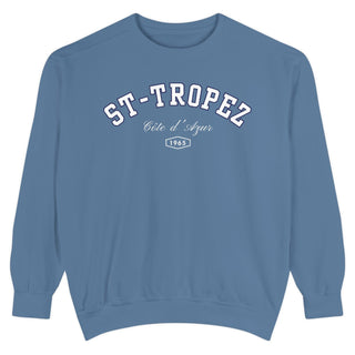 Blue sweatshirt with 'ST-TROPEZ' text on a white background