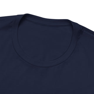 Close-up of a navy blue t-shirt with a plain background