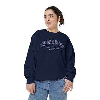 Person wearing a navy blue sweatshirt with 'LE MARINER' text on a white background