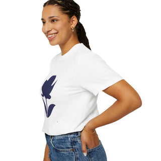 Woman wearing a white t-shirt with a blue floral design on a white background