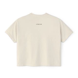 Beige t-shirt with 'Le Pique Club' logo on the back against a white background