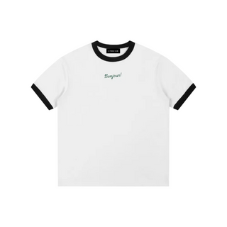 White t-shirt with black ringer sleeves and 'Bonjour!' text on a white background