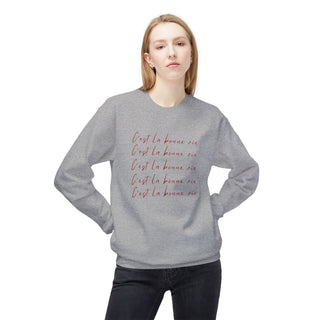 girl wearing a gray sweatshirt with text on a white background