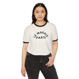 Woman wearing a white t-shirt with 'Le Marais Paris' text on a white background