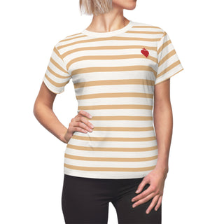 Person wearing a white and beige striped t-shirt with a red heart on a white background