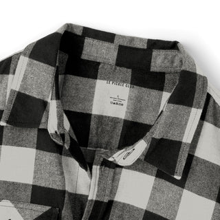 Black and white checkered shirt with a brand label on a white background