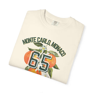 Folded cream-colored sweatshirt with 'Monte Carlo, Monaco 65' print on a white background