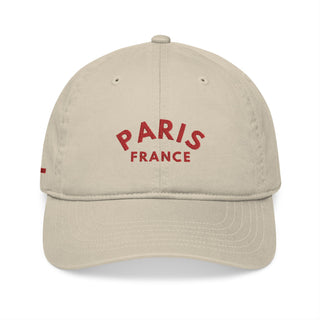 Beige cap with 'Paris France' text in red on a white background