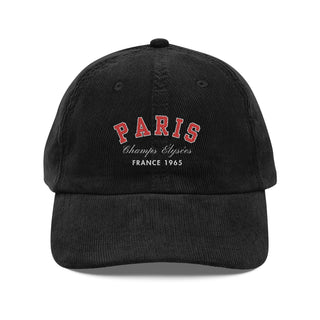 Black cap with 'PARIS Champs Elysèes France 1965' text on a white background
