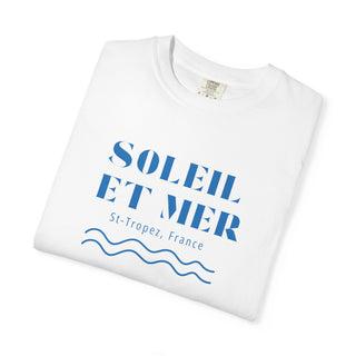 White t-shirt with blue text and wave design on a white background